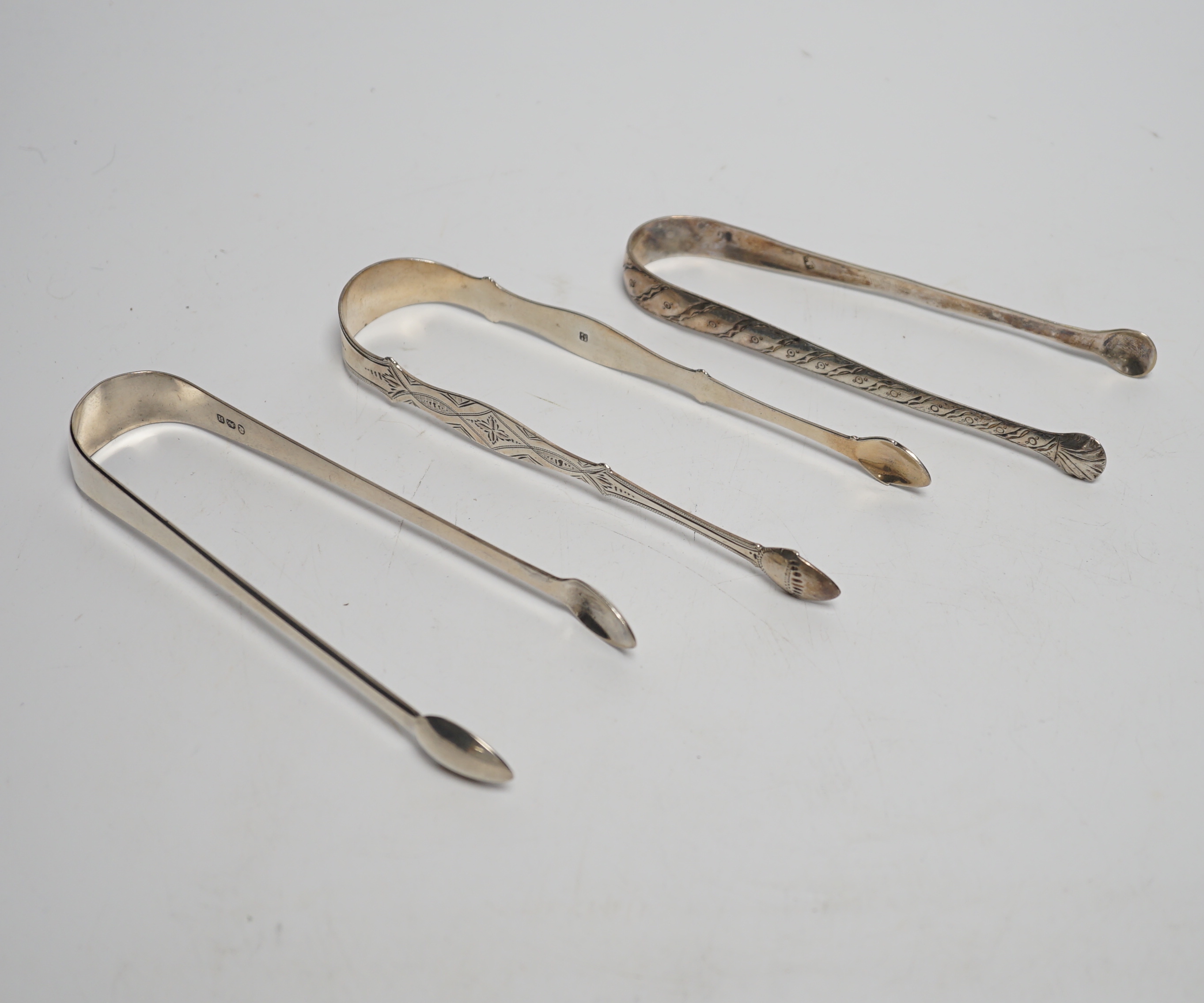 Eight assorted pairs of 18th and 19th century silver sugar tongs including Peter & Ann Bateman.